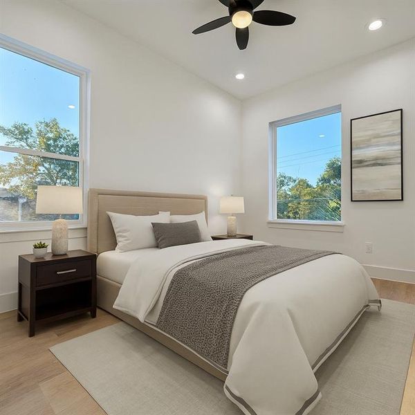 Bedroom with light wood finished floors, a ceiling fan, and recessed lighting