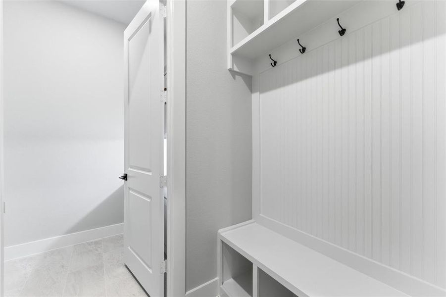 Mudroom featuring baseboards