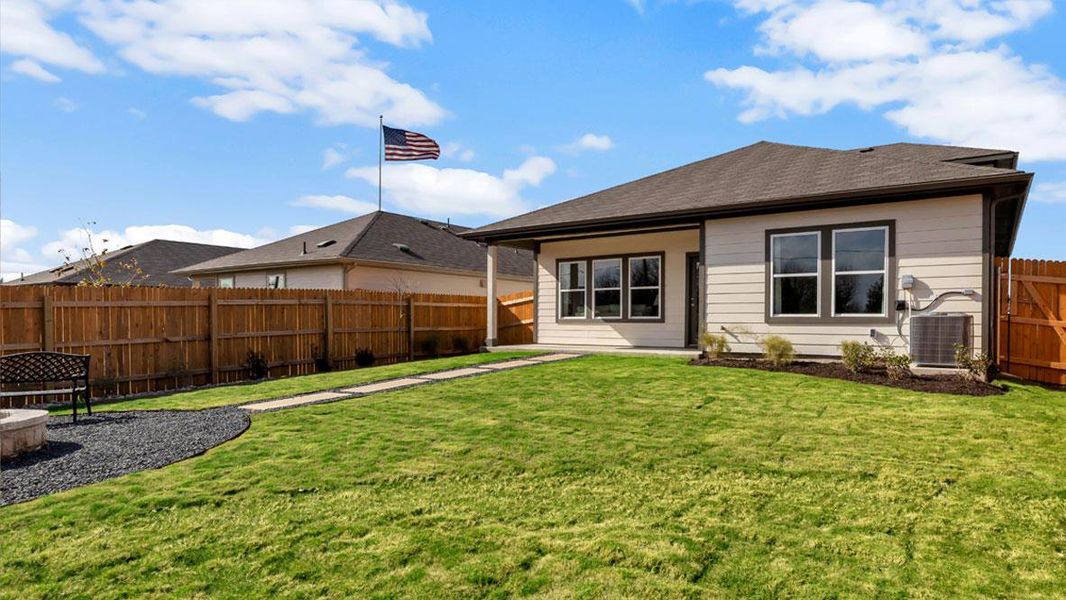 Front exterior of a new home in Carillon, Manor, TX, highlighting curb appeal (Image 20).
