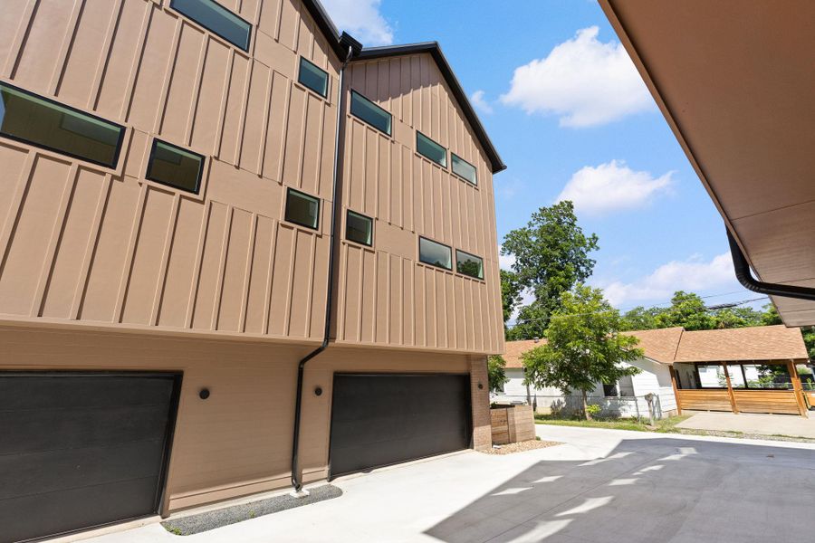 Modern townhome boasts sleek lines and private garages in a serene setting. Modern townhome boasts sleek lines and private garages in a serene setting.