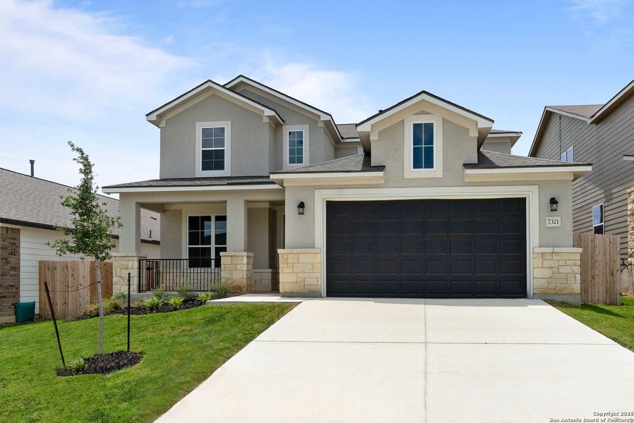 Front exterior of a new home in Skybrooke, San Antonio, TX, highlighting curb appeal (Image 18). Front exterior of a new home in Skybrooke, San Antonio, TX, highlighting curb appeal (Image 18).