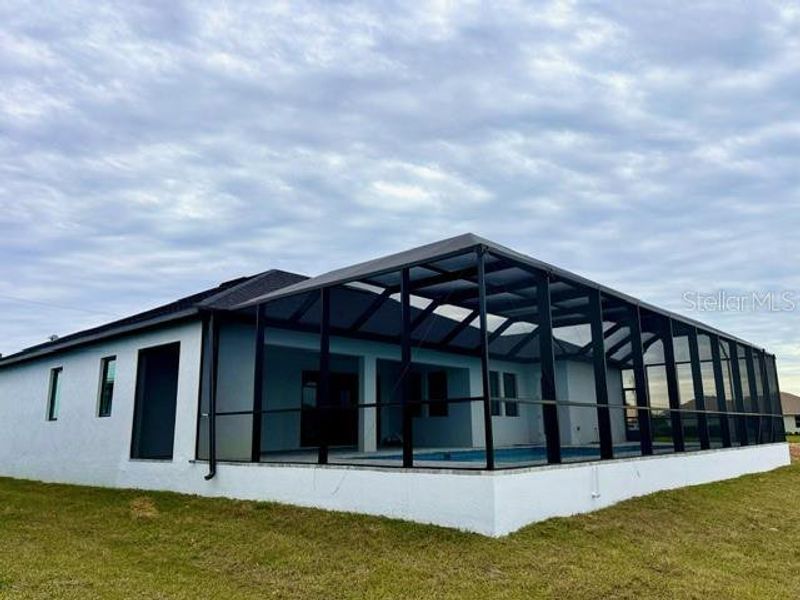 Front exterior of a new home in , Rotonda West, FL, highlighting curb appeal (Image 23).