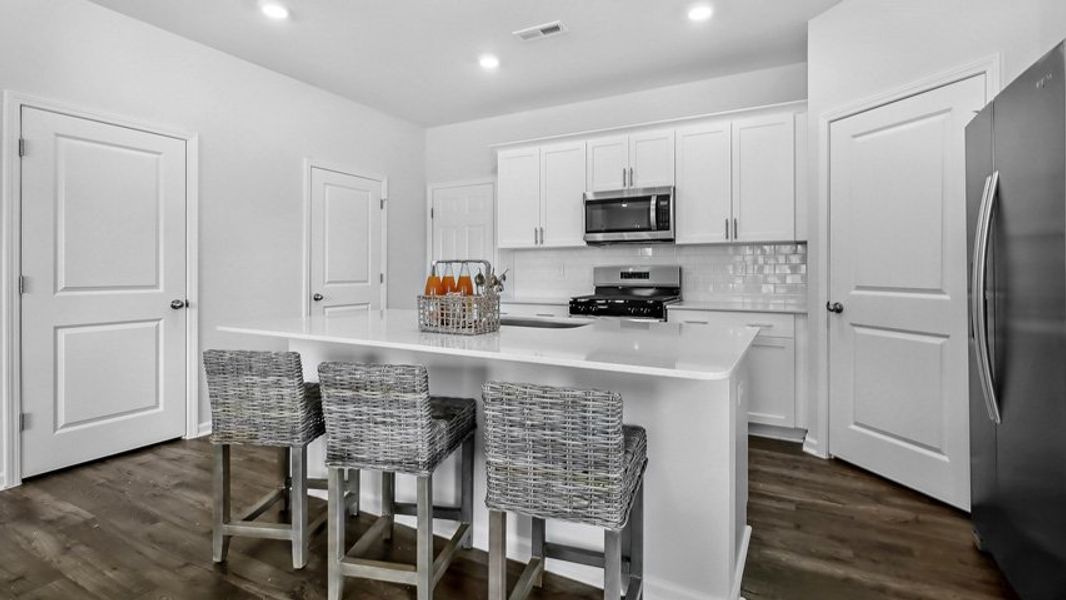 Representative furnished interior of a home built from the Collin by D.R. Horton in The Townes at Anderson Farm, Wendell (Image 4).