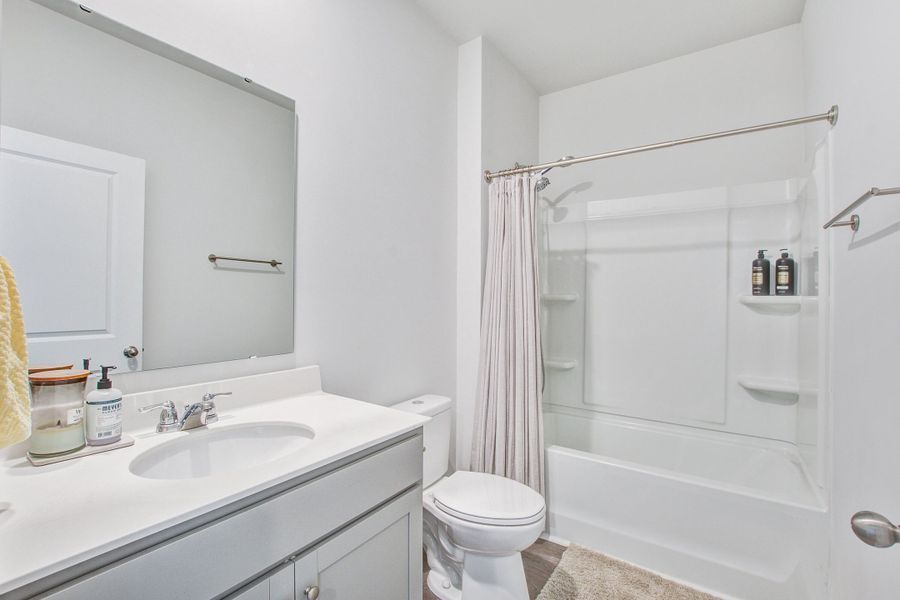Furnished interior view inside a new home in Pine Hills at Cane Bay, Summerville (Image 39).