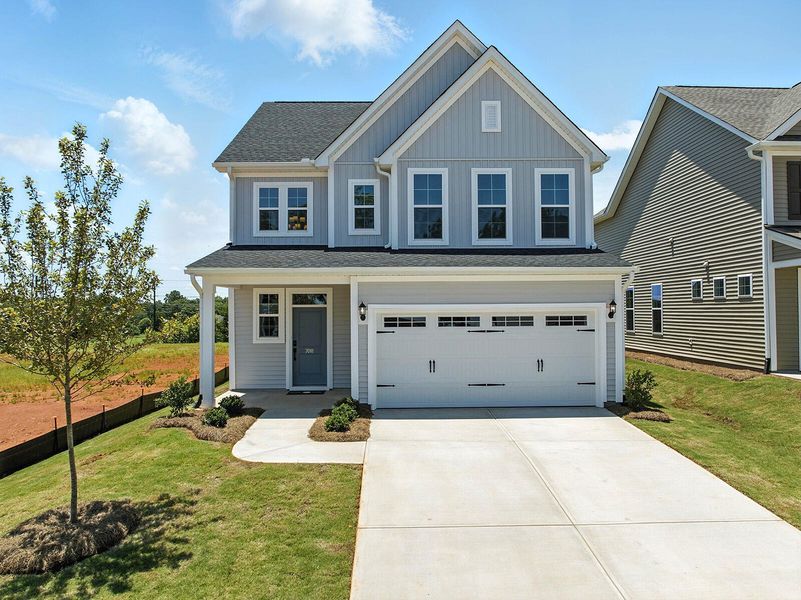 Front exterior of a new home in Six Oaks, Summerville, SC, highlighting curb appeal (Image 2).
