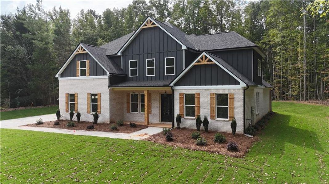 Front exterior of a new home in , Monroe, GA, highlighting curb appeal (Image 13). Front exterior of a new home in , Monroe, GA, highlighting curb appeal (Image 13).