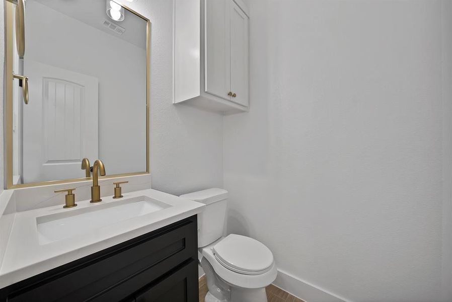 Half bathroom with vanity.