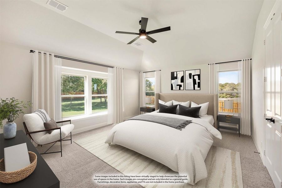 Spacious master bedroom with vaulted ceiling, ceiling fan, large windows, and neutral carpet flooring
