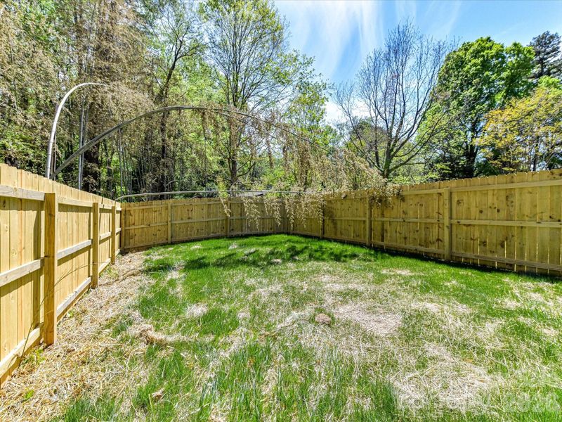 Fully fenced backyard with a privacy fence offers a private outdoor space perfect for relaxing, entertaining, or pets to play freely.