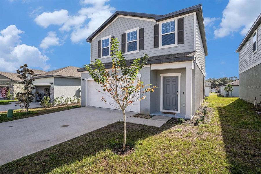 Front exterior of a new home in , Dade City, FL, highlighting curb appeal (Image 1). Front exterior of a new home in , Dade City, FL, highlighting curb appeal (Image 1).