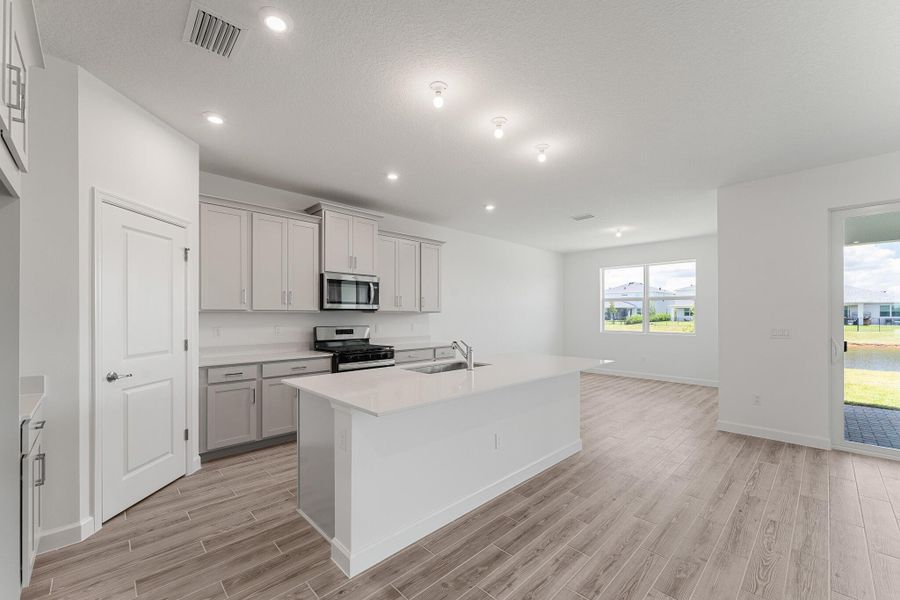 Furnished interior view inside a new home in Tradition - Cadence, Port St. Lucie (Image 4). Furnished interior view inside a new home in Tradition - Cadence, Port St. Lucie (Image 4).