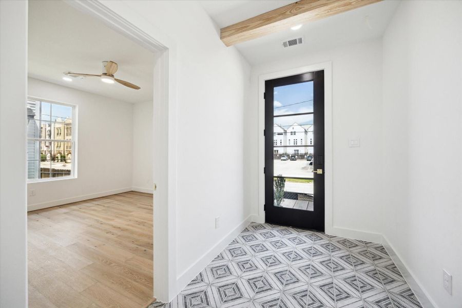 The first floor bedroom or study is right off the sunny entrance.