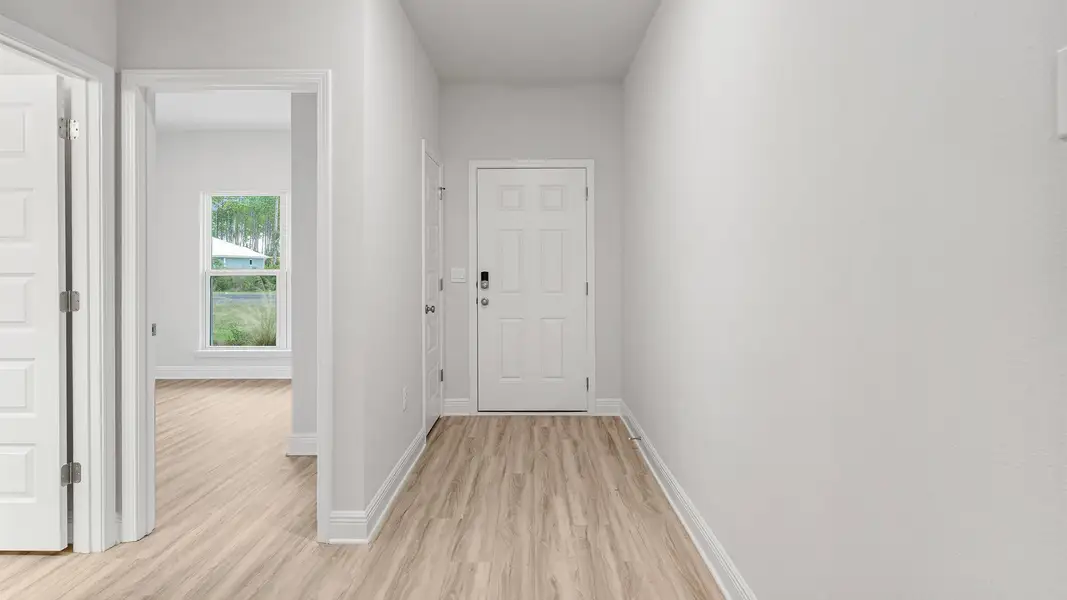 Representative unfurnished interior of a home built from the The Rhett by D.R. Horton in Pine Creek and Heron Walk, Port St. Joe (Image 13).