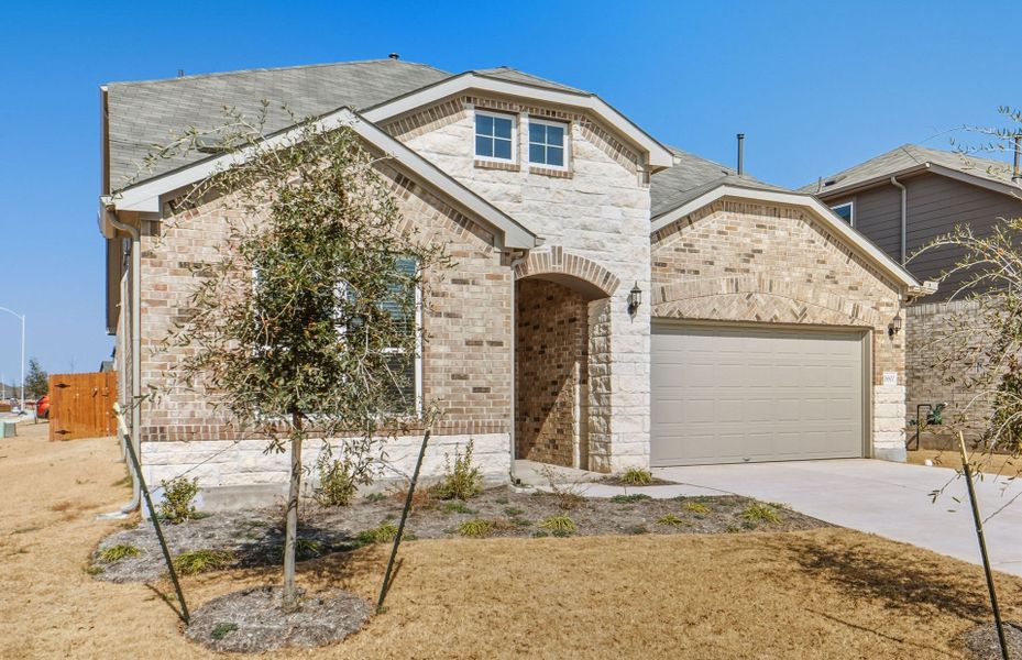 Front exterior of a new home in Lagos, Manor, TX, highlighting curb appeal (Image 21).