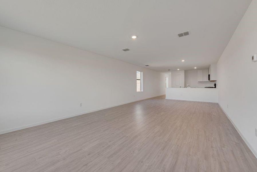 Unfurnished living room featuring recessed lighting and light wood-style floors