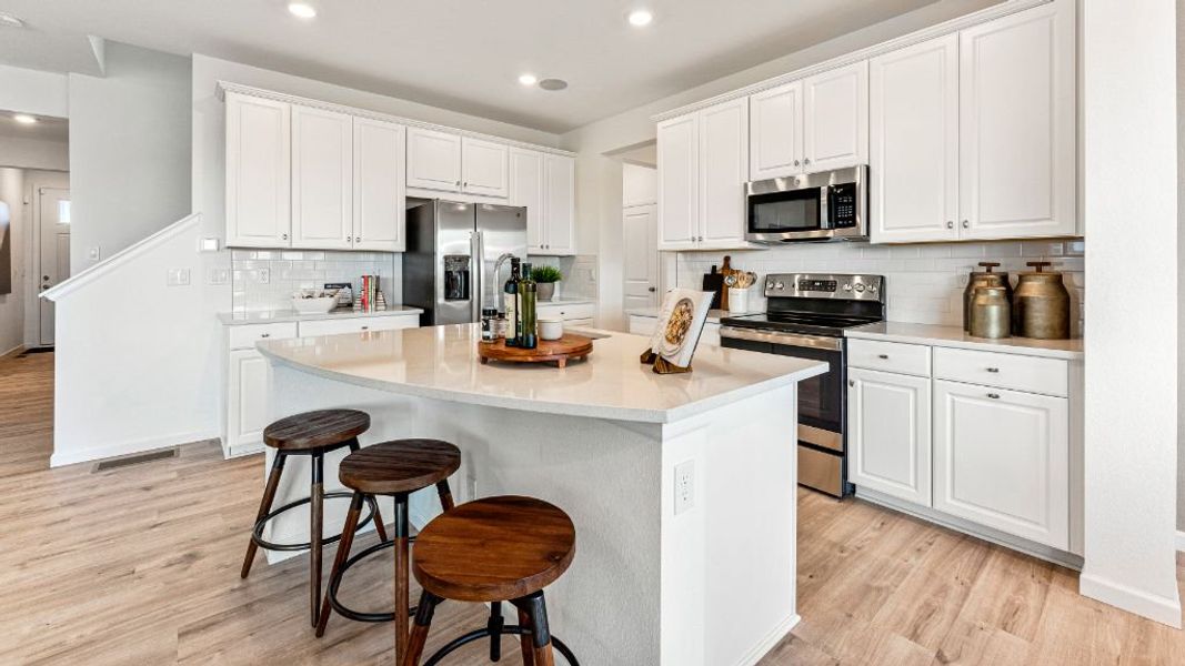 Furnished interior view inside a new home in The Aurora Highlands, Aurora (Image 6).