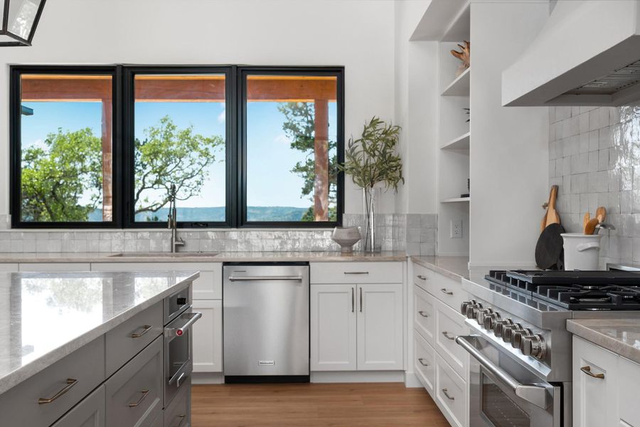 This is a TO BE BUILT custom home on 6.75 acres in Rainbow Ranch, Wimberley TX.