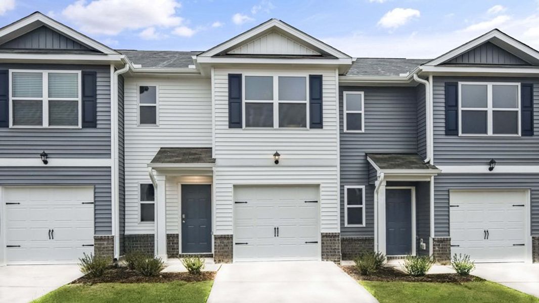 Front exterior of a new home in The Townes at Wilson's Ridge, Smithfield, NC, highlighting curb appeal (Image 1). Front exterior of a new home in The Townes at Wilson's Ridge, Smithfield, NC, highlighting curb appeal (Image 1).
