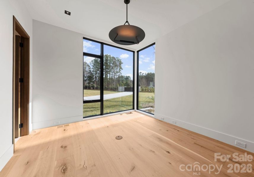 Main-level office or additional bedroom. Main-level office or additional bedroom.