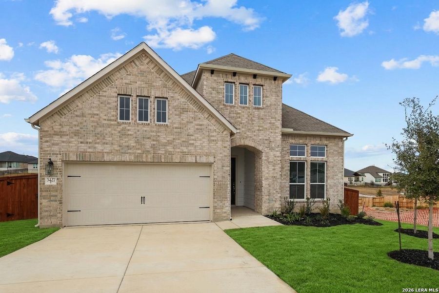Front exterior of a new home in Homestead, Schertz, TX, highlighting curb appeal (Image 26). Front exterior of a new home in Homestead, Schertz, TX, highlighting curb appeal (Image 26).