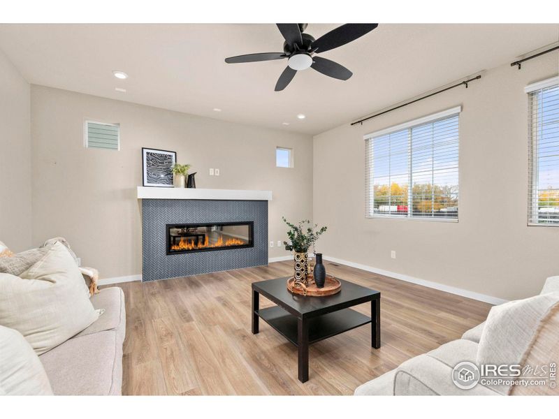 Living Room with a Grand Fireplace as its Centerpiece