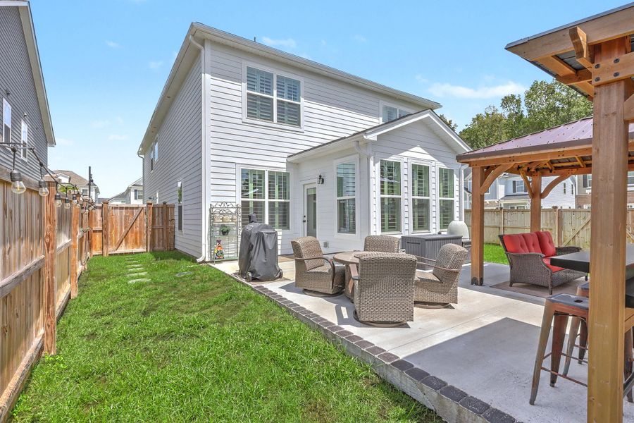 Exterior details and patio area of a home in , Johns Island (Image 29).
