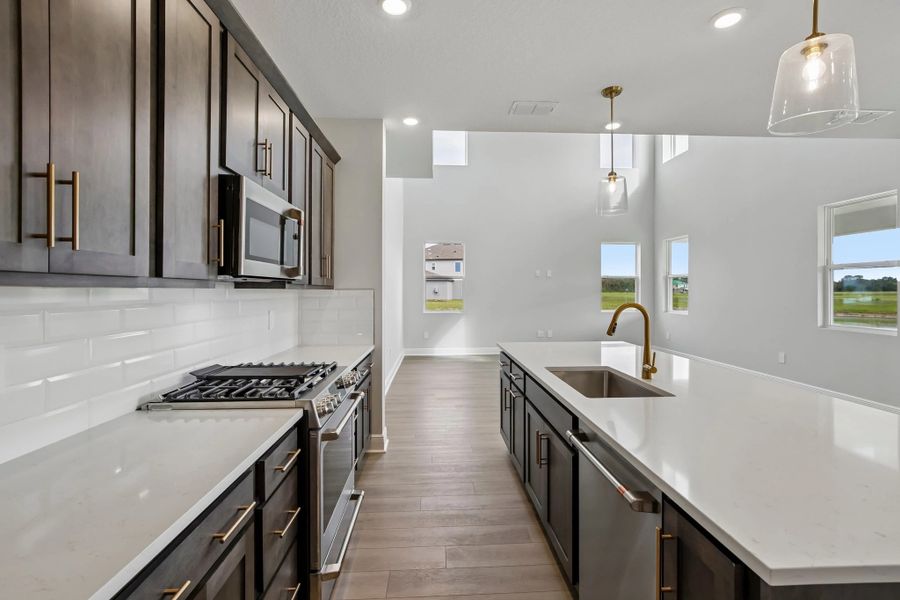 Kitchen opens up into the two story family room