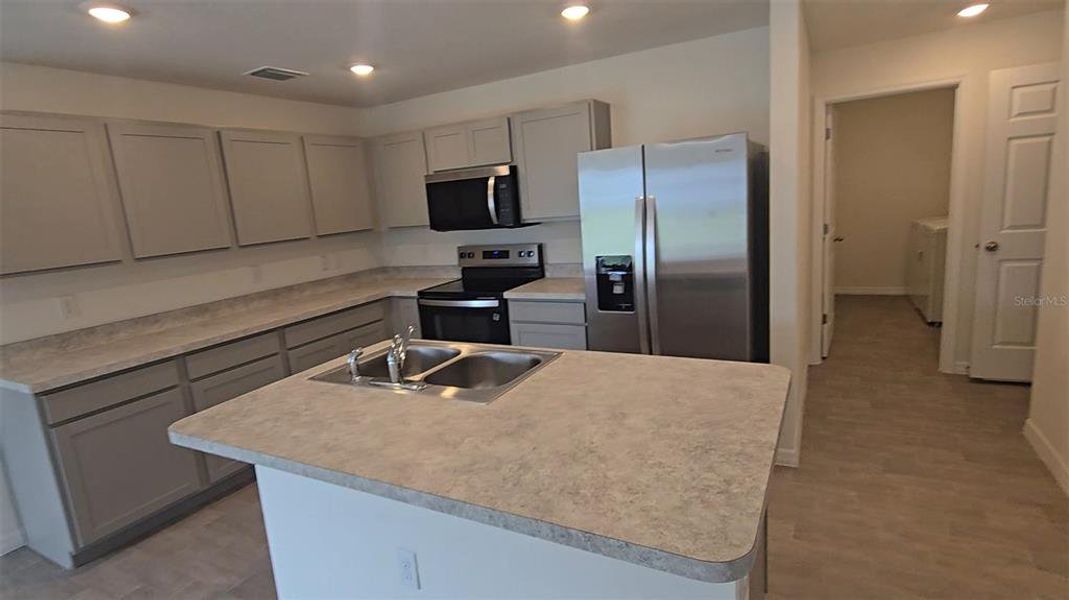 Furnished interior view inside a new home in , Poinciana (Image 10). Furnished interior view inside a new home in , Poinciana (Image 10).