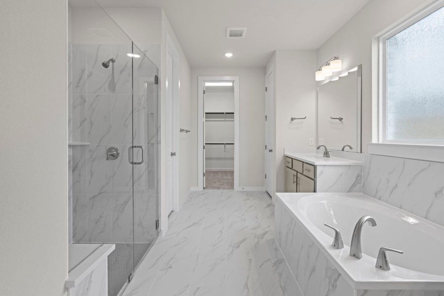 Primary Bath retreat with dual vanities, garden tub & walk-in shower Primary Bath retreat with dual vanities, garden tub & walk-in shower