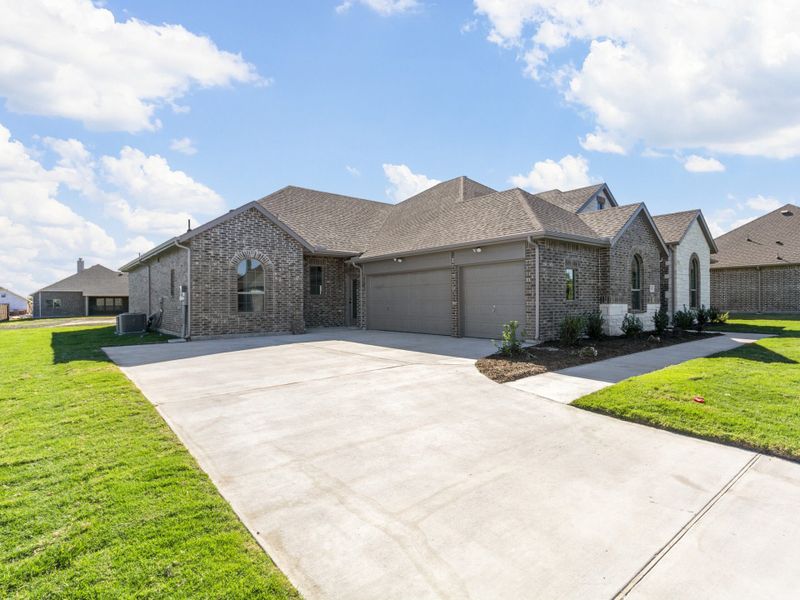 Representative exterior photo of a completed home built from the Eliot II by Robbie Hale Homes in High Meadows Estates, Nevada, TX (Image 1). Representative exterior photo of a completed home built from the Eliot II by Robbie Hale Homes in High Meadows Estates, Nevada, TX (Image 1).