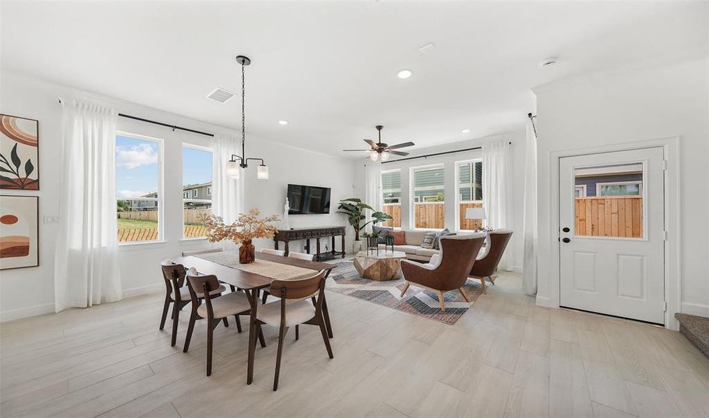 View of dining area and great room (*Photo not of actual home and used for illustration purposes only.)