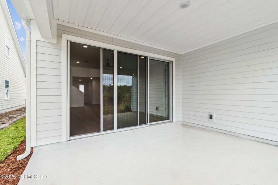 Exterior details and patio area of a home in Evergreen Island at Silverleaf - Classic, St. Augustine (Image 17).