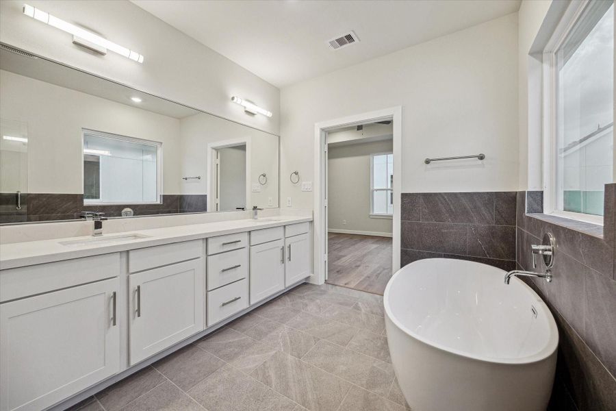 Spacious secondary bath with a beautiful floating tub
