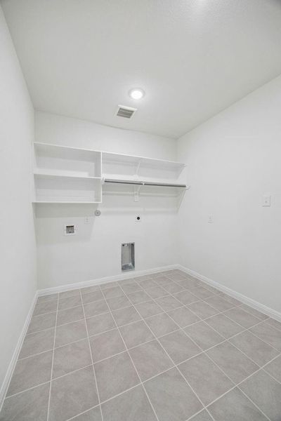 Utility Room in the Magnolia home plan by Trophy Signature Homes – REPRESENTATIVE PHOTO