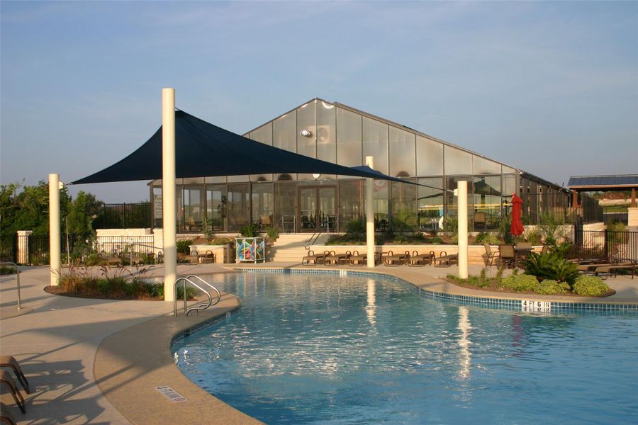An inviting community pool with ample lounge areas complements the modern clubhouse, perfect for relaxation and social gatherings. An inviting community pool with ample lounge areas complements the modern clubhouse, perfect for relaxation and social gatherings.