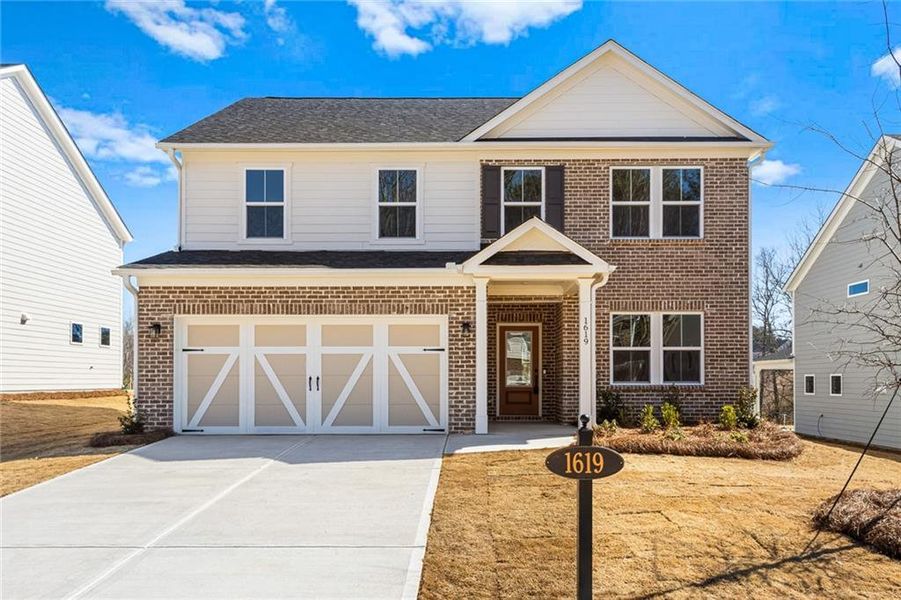 Front exterior of a new home in Berkeley Mill, Cumming, GA, highlighting curb appeal (Image 14).