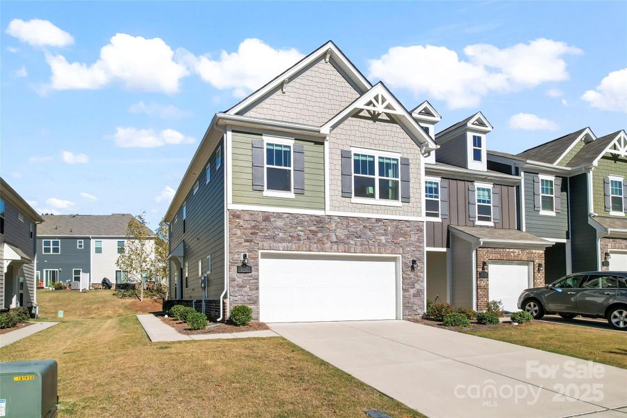 Front exterior of a new home in Harper's Run, Matthews, NC, highlighting curb appeal (Image 23).