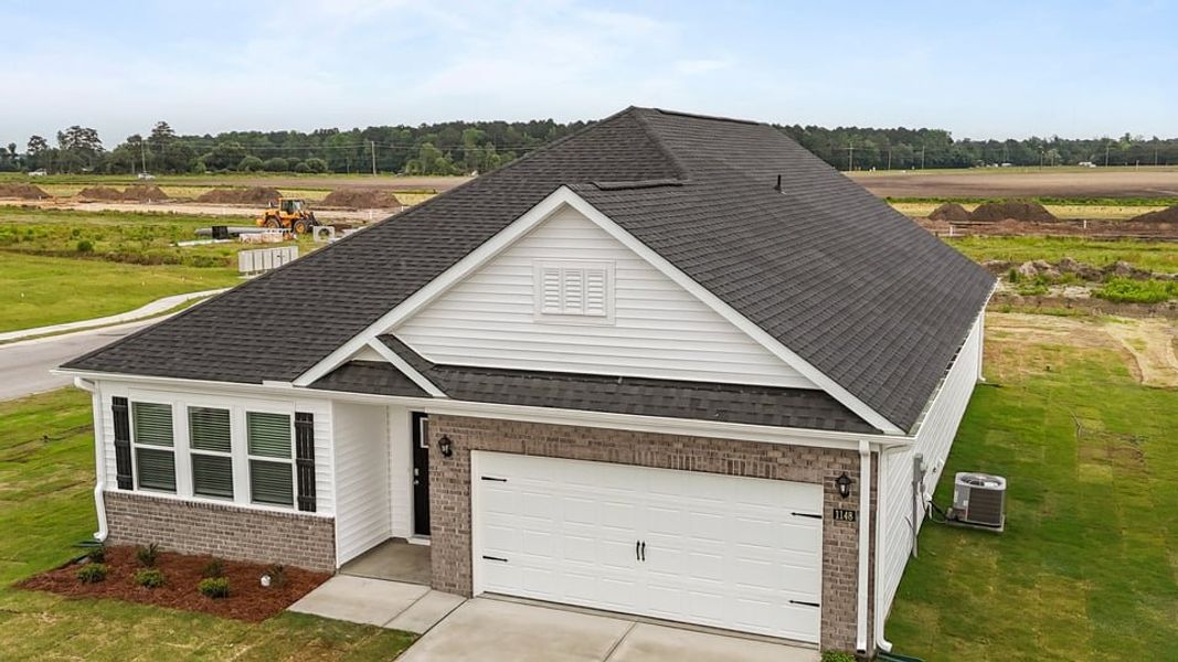Front exterior of a new home in East Ridge, Ayden, NC, highlighting curb appeal (Image 17).