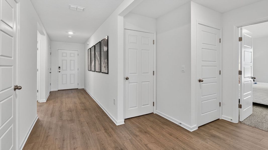 Representative unfurnished interior of a home built from the CALI by D.R. Horton in Sawmill Branch Express, Palm Coast (Image 21).