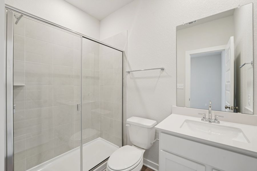 A bathroom with a glass shower.