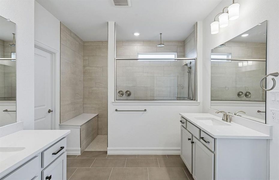 Owner's bath with dual vanities