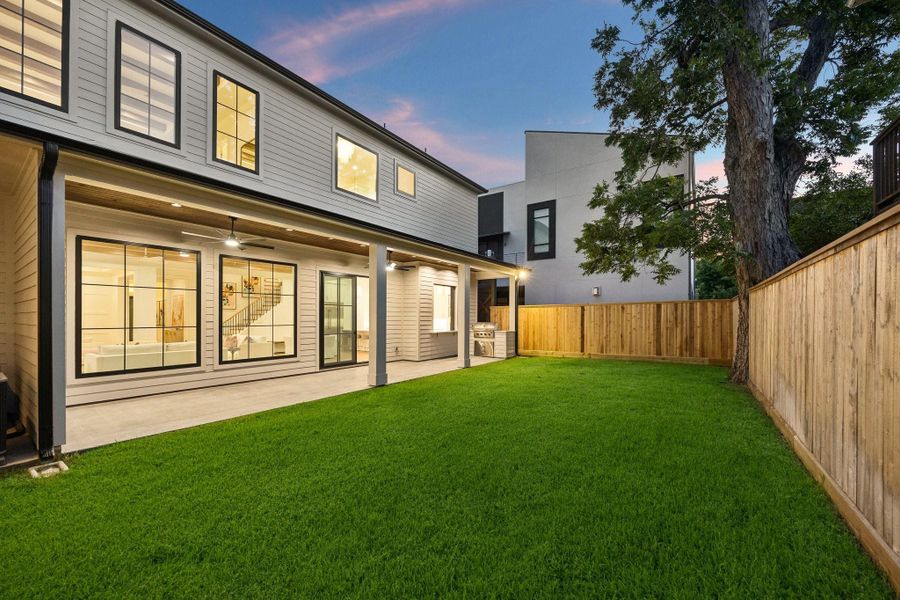 Evening view of the back of the home. The yard has plenty of room for a pool! Evening view of the back of the home. The yard has plenty of room for a pool!