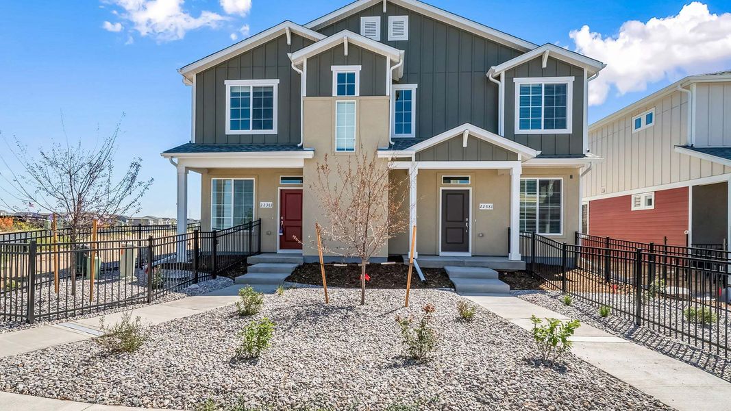 Front exterior of a new home in Green Valley Ranch, Aurora, CO, highlighting curb appeal (Image 1). Front exterior of a new home in Green Valley Ranch, Aurora, CO, highlighting curb appeal (Image 1).