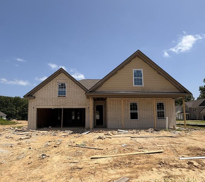 Brick facade residence featuring multiple gable roofs, double-hung windows, and a covered entry Brick facade residence featuring multiple gable roofs, double-hung windows, and a covered entry