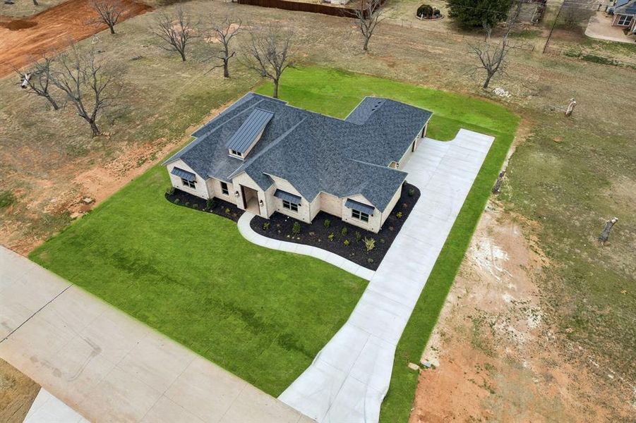 Front exterior of a new home in , Granbury, TX, highlighting curb appeal (Image 22).
