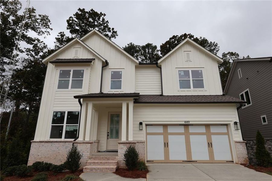 Front exterior of a new home in Havencroft, Woodstock, GA, highlighting curb appeal (Image 1).