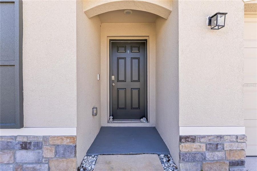 Front exterior of a new home in Berry Bay, Wimauma, FL, highlighting curb appeal (Image 22). Front exterior of a new home in Berry Bay, Wimauma, FL, highlighting curb appeal (Image 22).