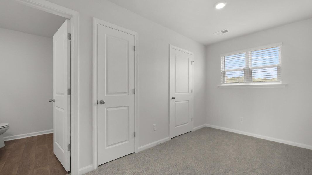 Spacious, unfurnished interior of a new home in Pine Hills Townhomes at Cane Bay, Summerville (Image 12).