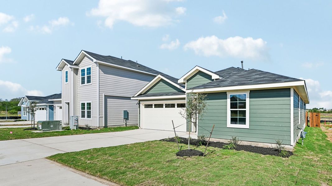 Front exterior of a new home in Watermill, Uhland, TX, highlighting curb appeal (Image 17). Front exterior of a new home in Watermill, Uhland, TX, highlighting curb appeal (Image 17).