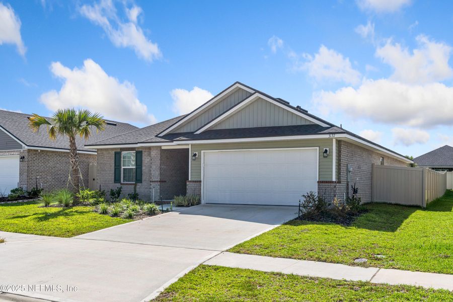 Front exterior of a new home in Shadow Crest at Rolling Hills, Green Cove Springs, FL, highlighting curb appeal (Image 22).